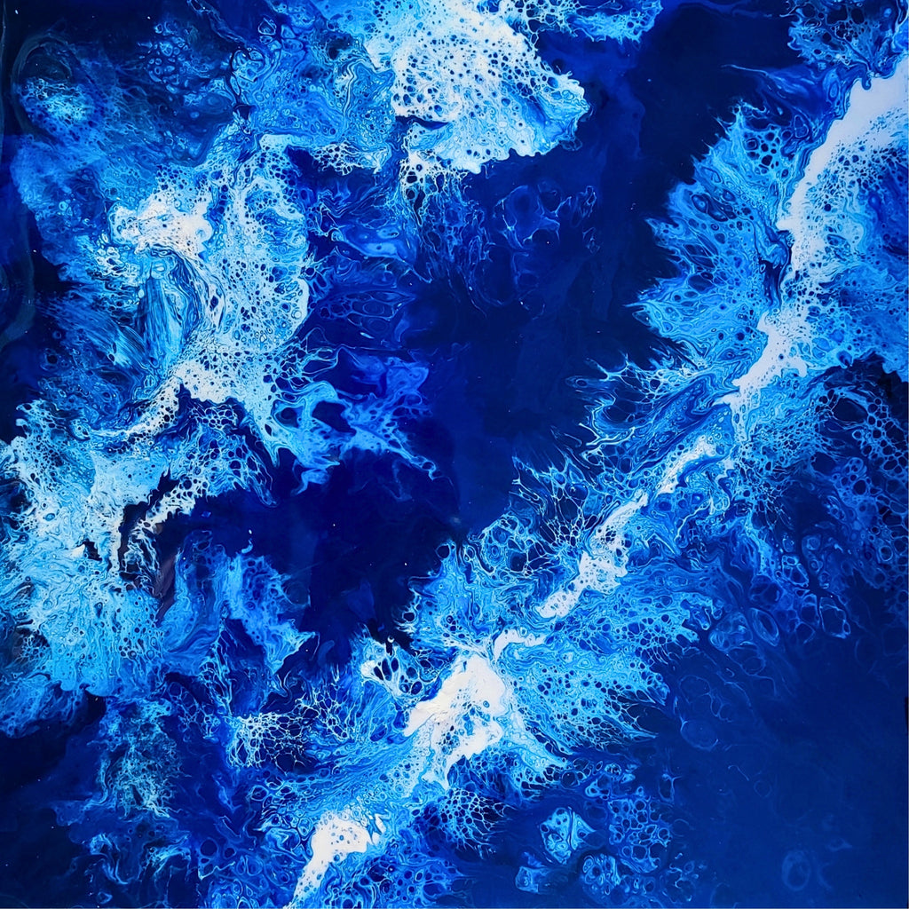 Abstract blue and white pattern resembling water or ice.