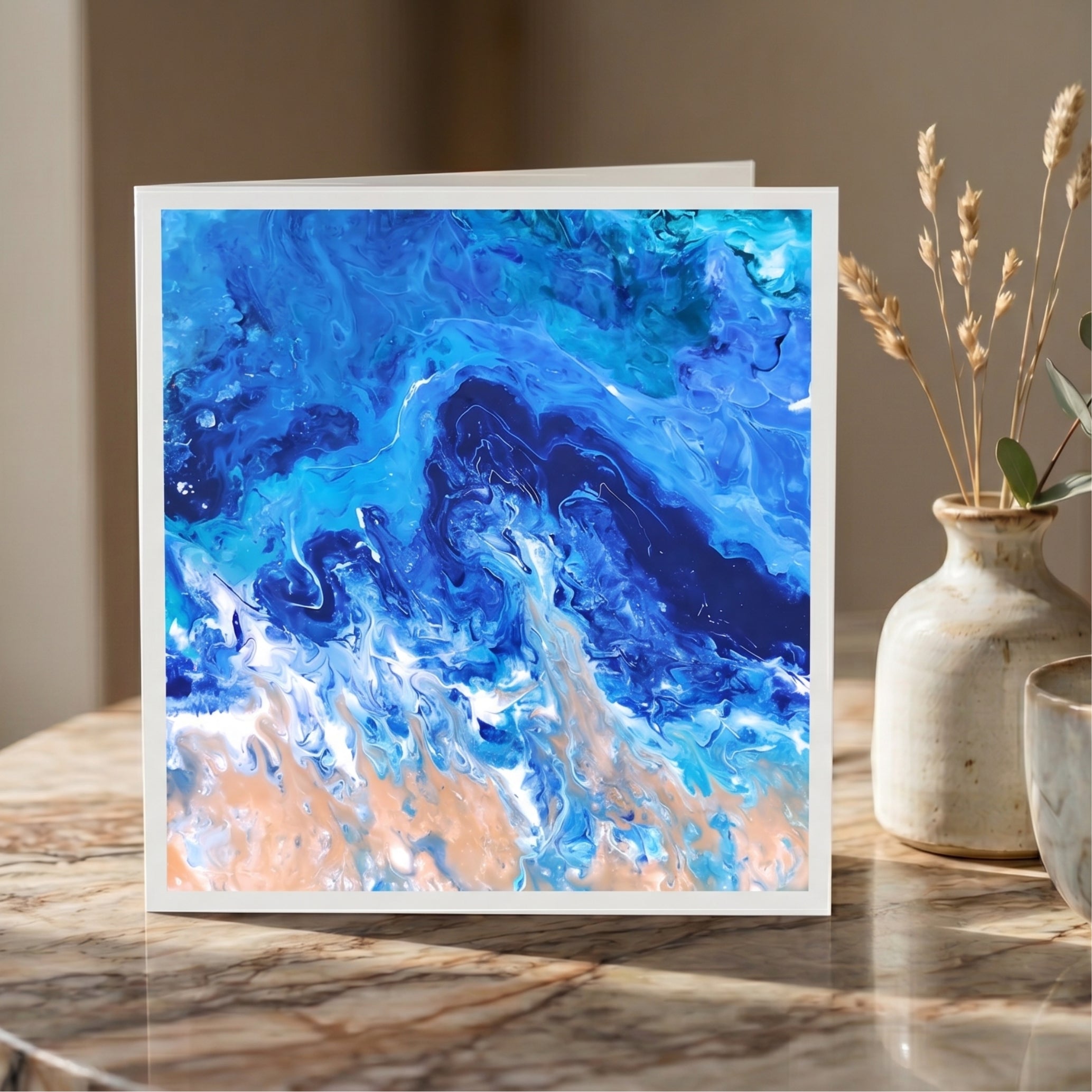 Abstract blue and white painting on a marble surface with decorative elements.