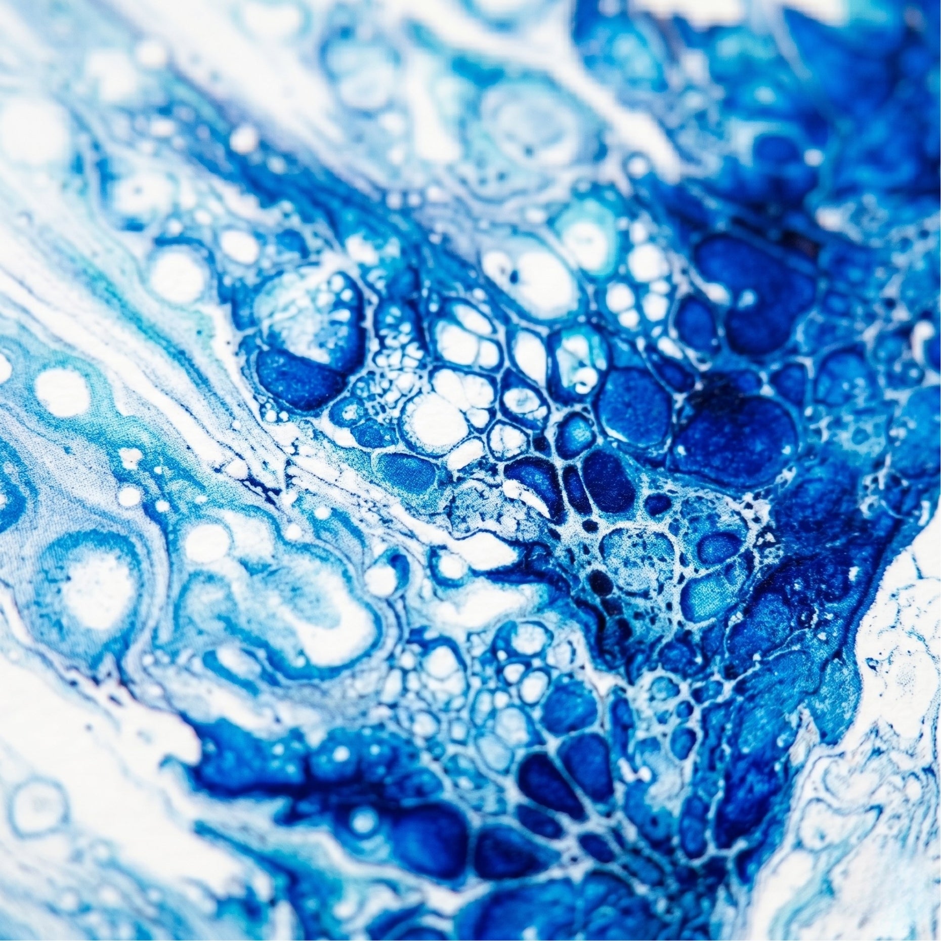 Close-up of blue and white bubbles and liquid texture