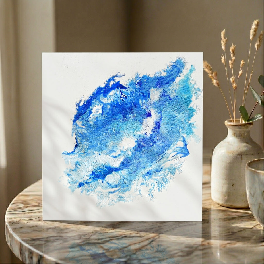  Abstract blue painting on a white card displayed on a marble surface with decorative vases.