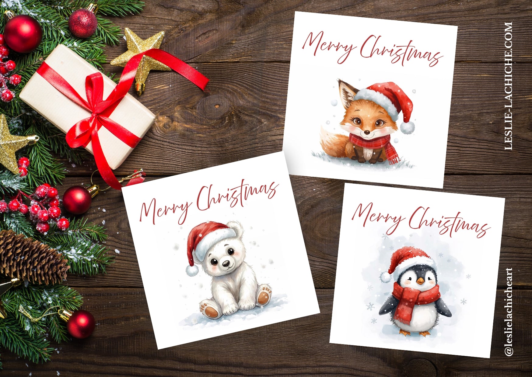 Three Christmas-themed cards with animals on a wooden surface with festive decorations.