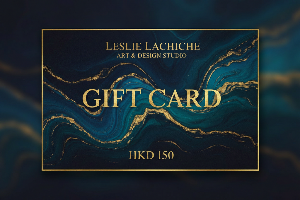 A Leslie Lachiche Art & Design Studio gift card with a dark teal and black marble pattern accented by flowing gold veins, featuring gold lettering that reads 'GIFT CARD' and 'HKD 150'.