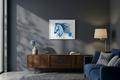 Living room with a blue horse painting on the wall, wooden sideboard, and blue sofa.