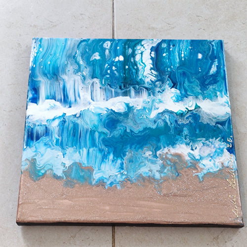 Abstract blue and white painting on a wooden panel against a tiled wall.