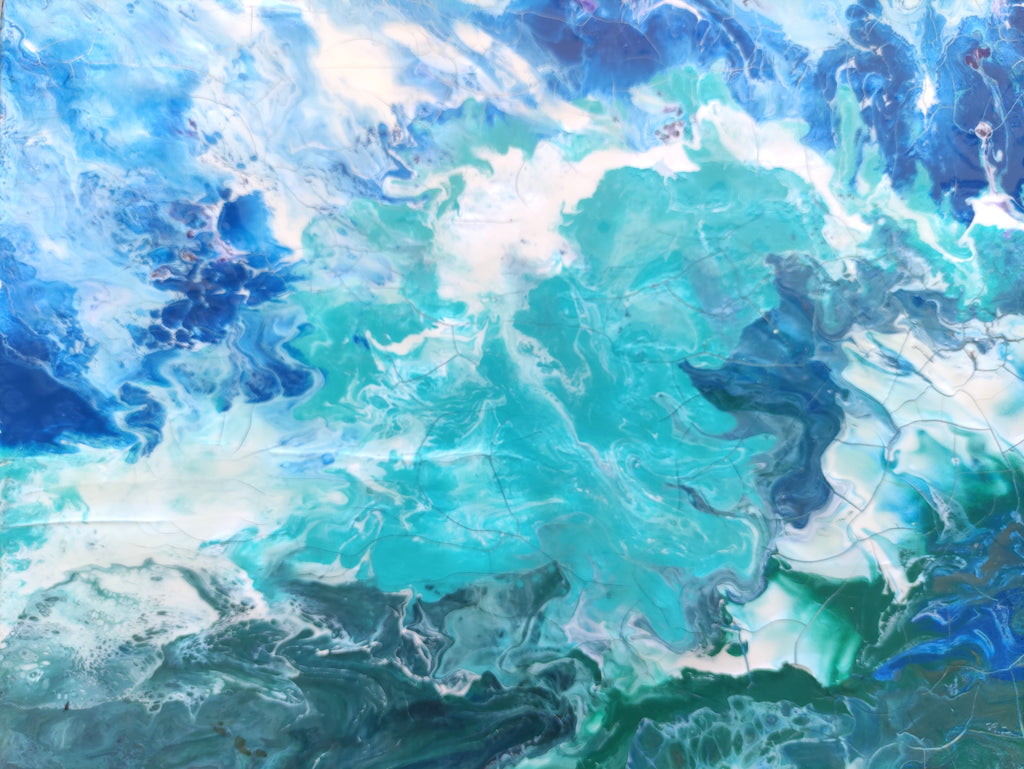 Abstract artwork with swirling blue and green colors