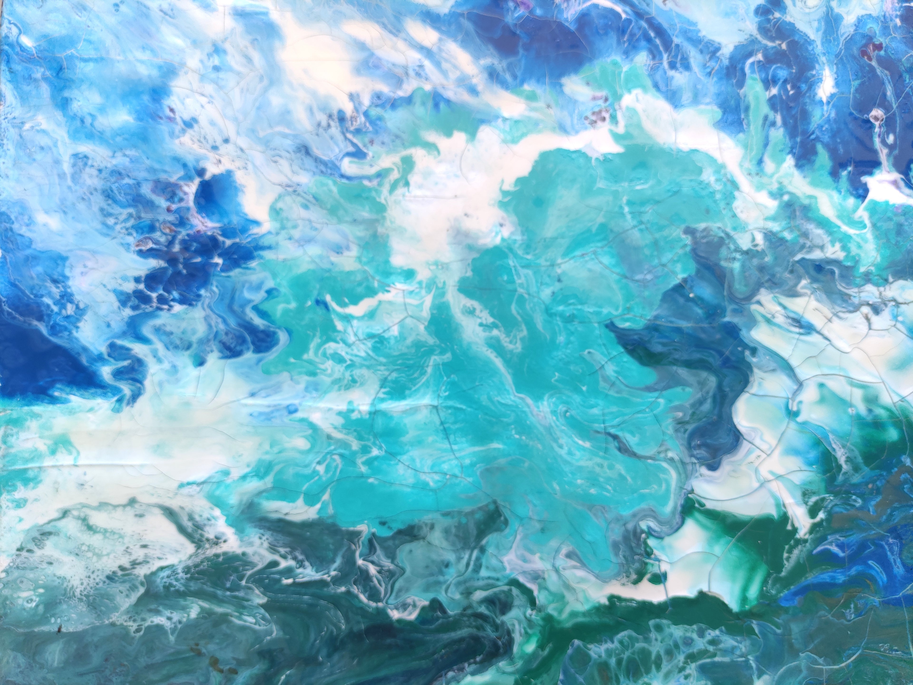 Abstract artwork with swirling blue and green colors