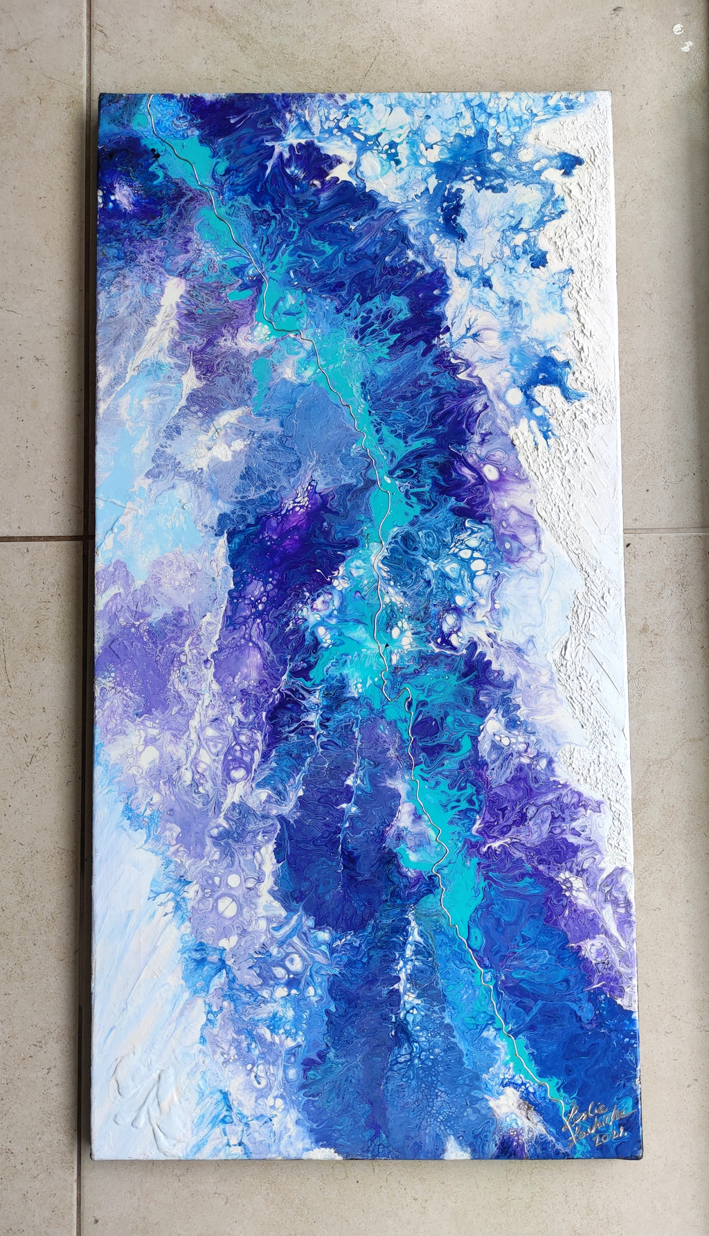 Abstract painting with blue and purple hues on a textured surface