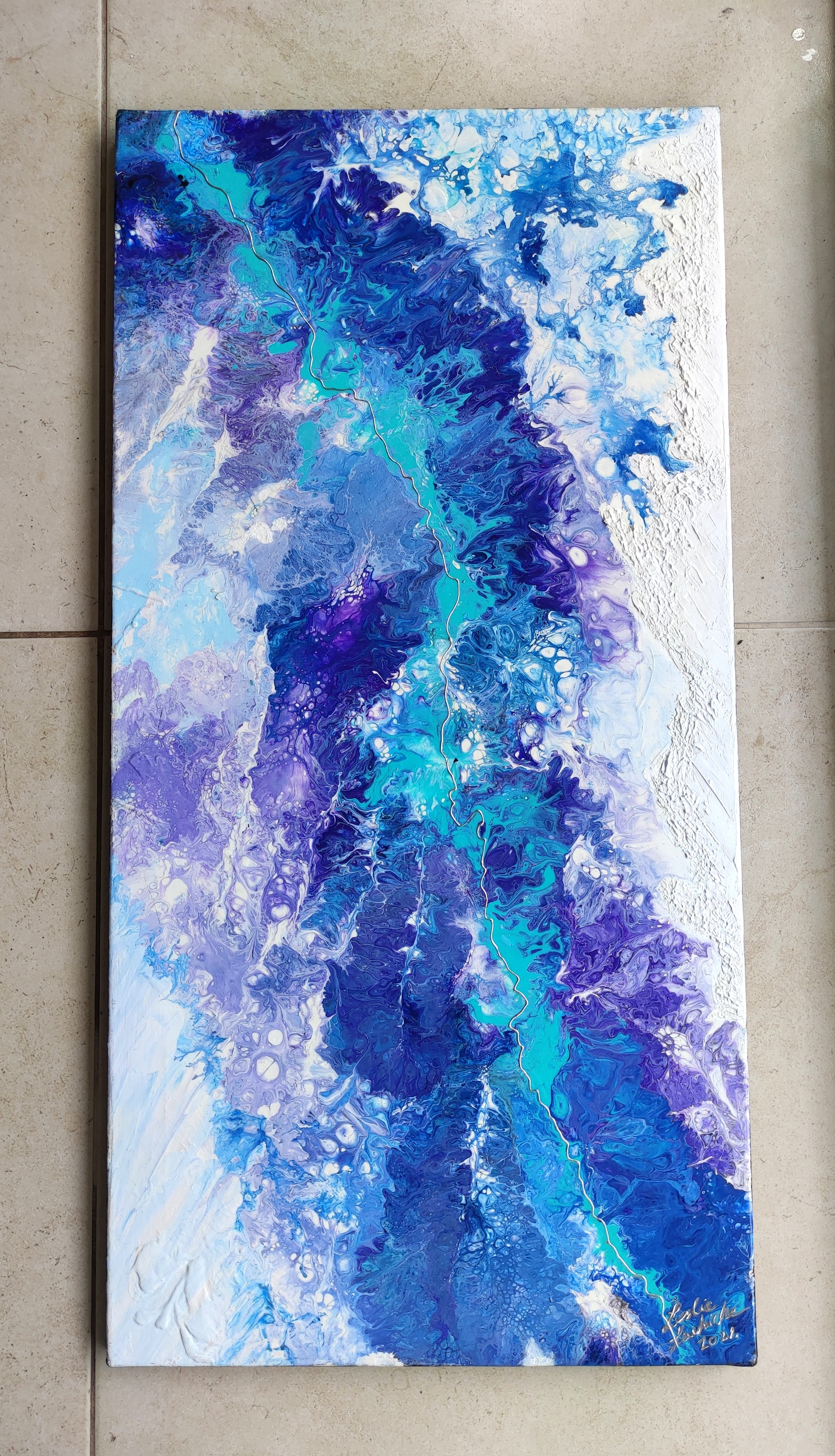 Abstract painting with blue and purple hues on a textured surface
