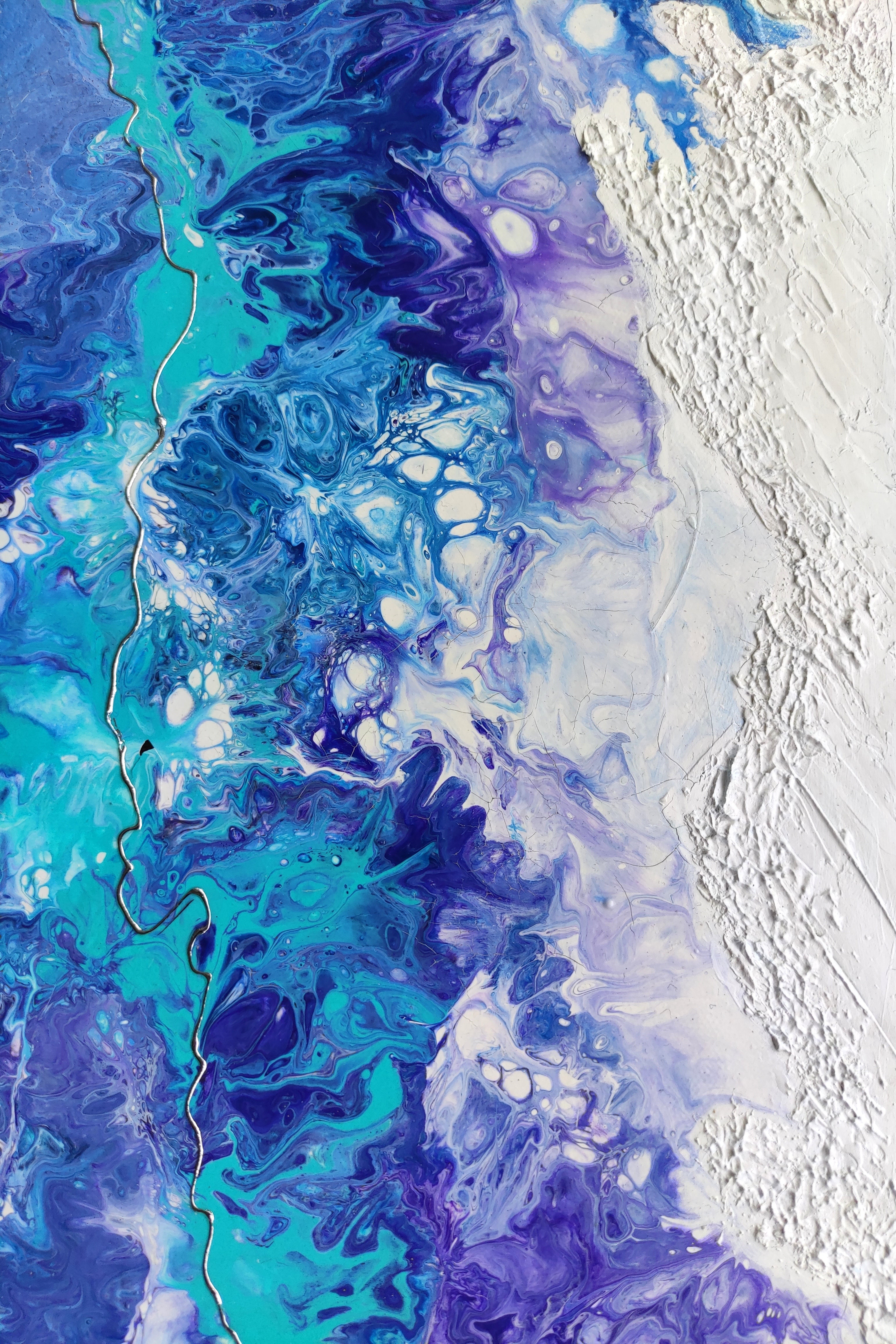 Abstract art with blue and purple colors on a textured white background