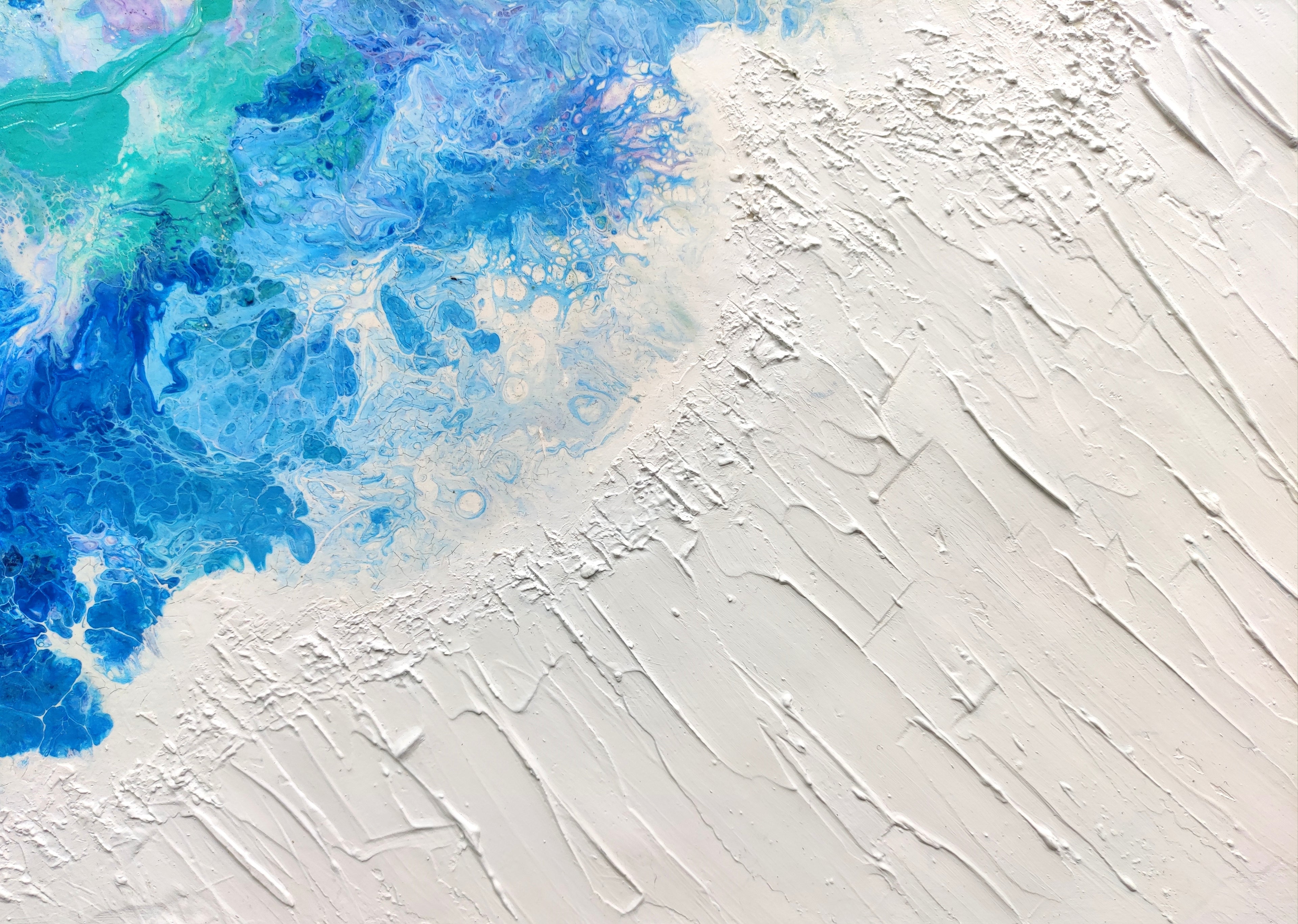 Abstract art with blue and white colors on a textured surface