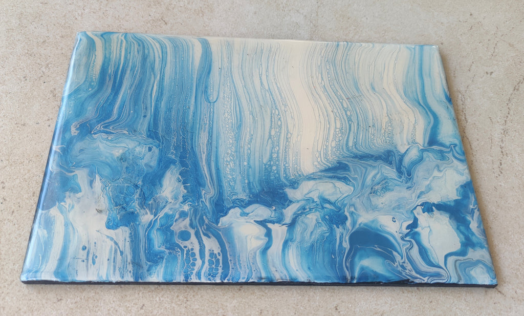 Blue and white marbled fabric on a beige surface
