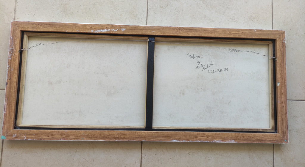 Wooden picture frame with glass on a tiled floor