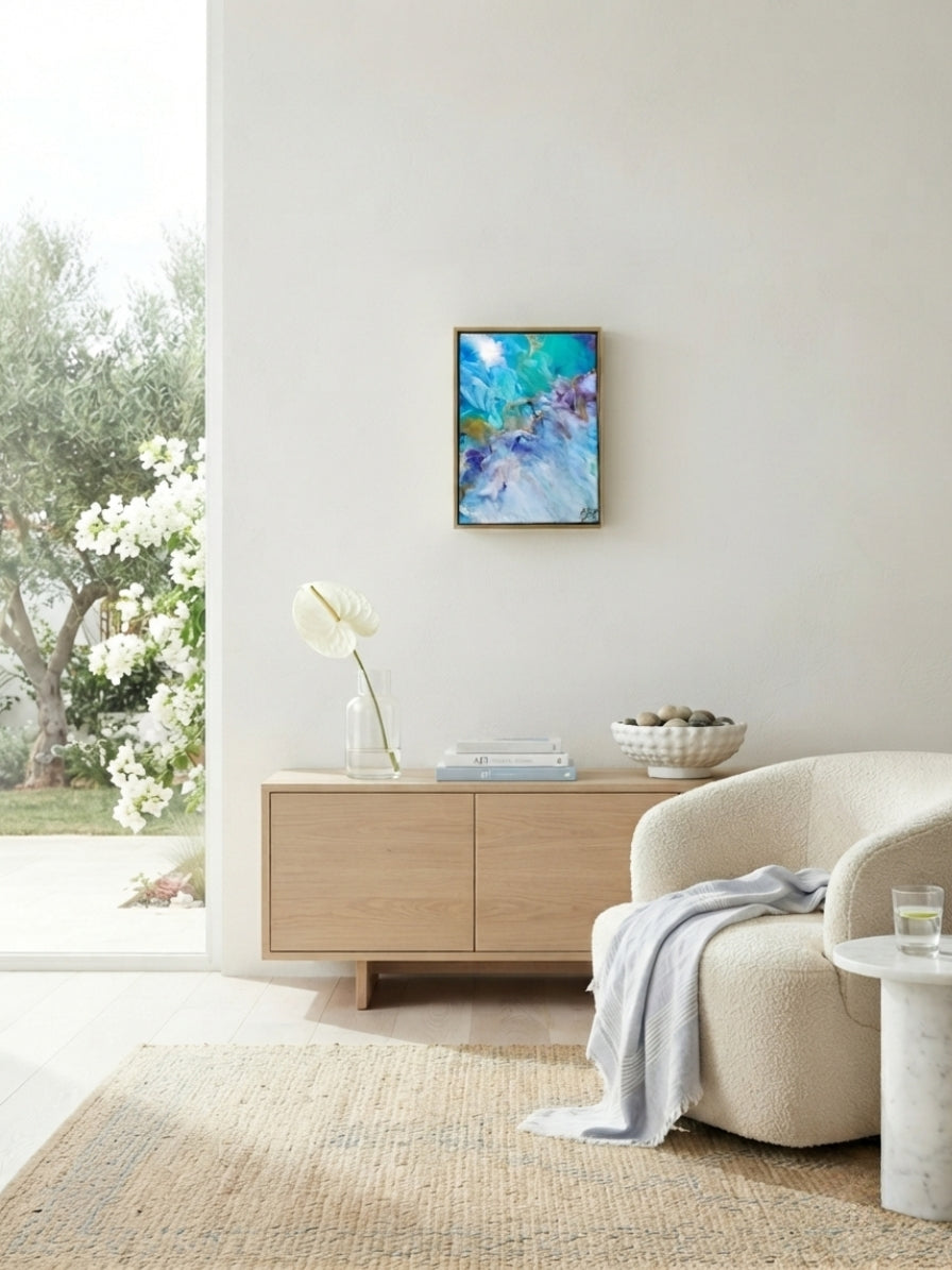 abstract painting on wall in a bright living room