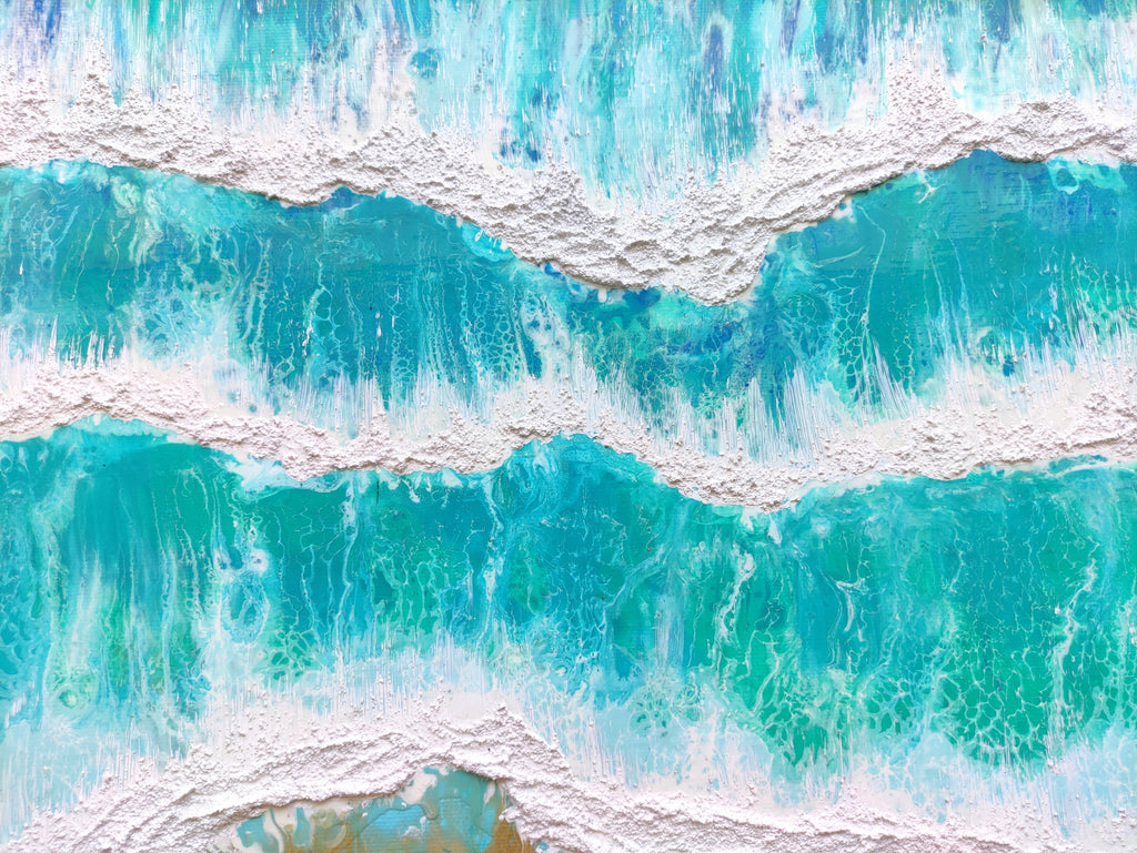 Close-up of blue and green water with white foam at the top