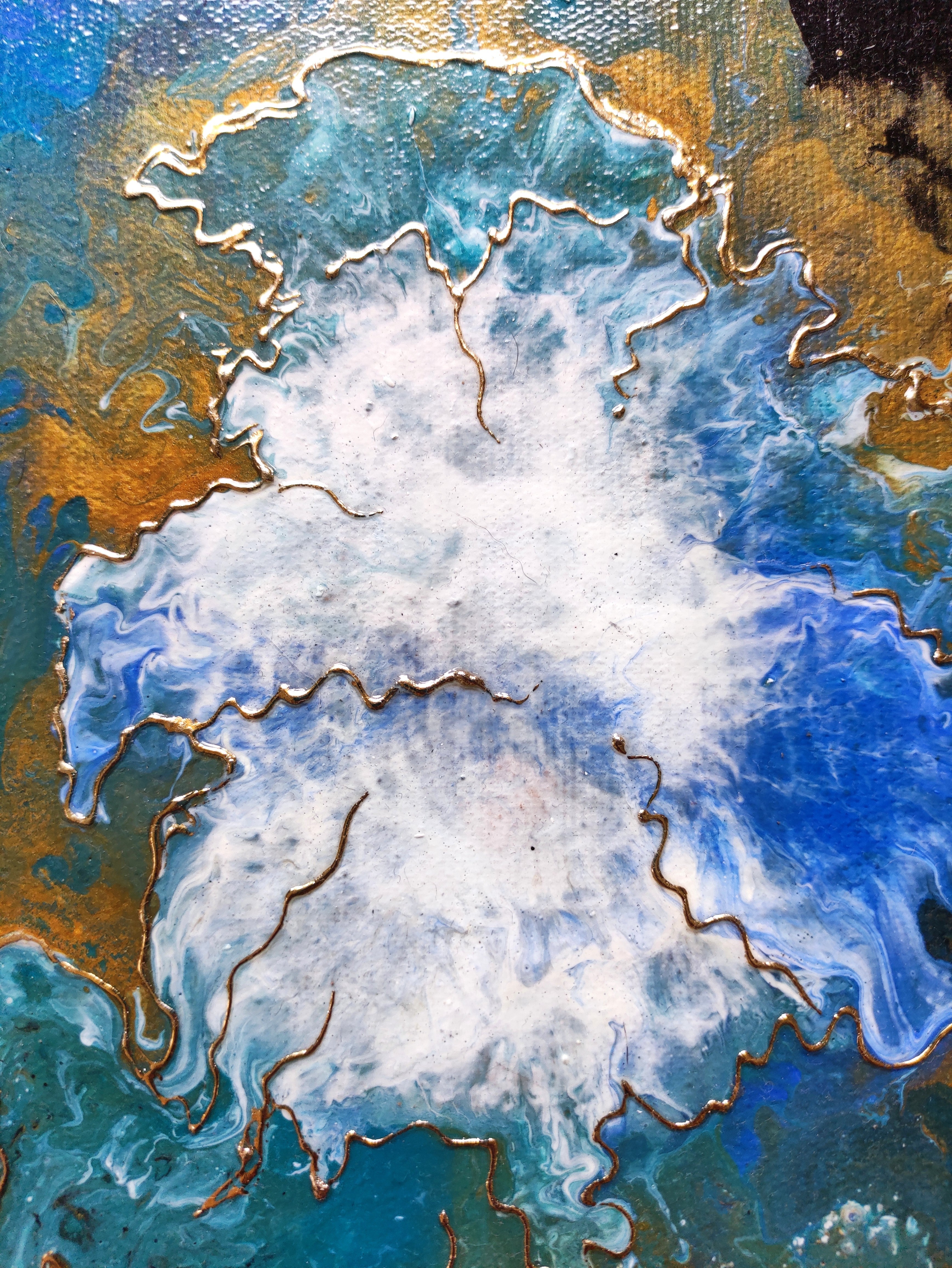 Abstract art with blue, white, and gold colors
