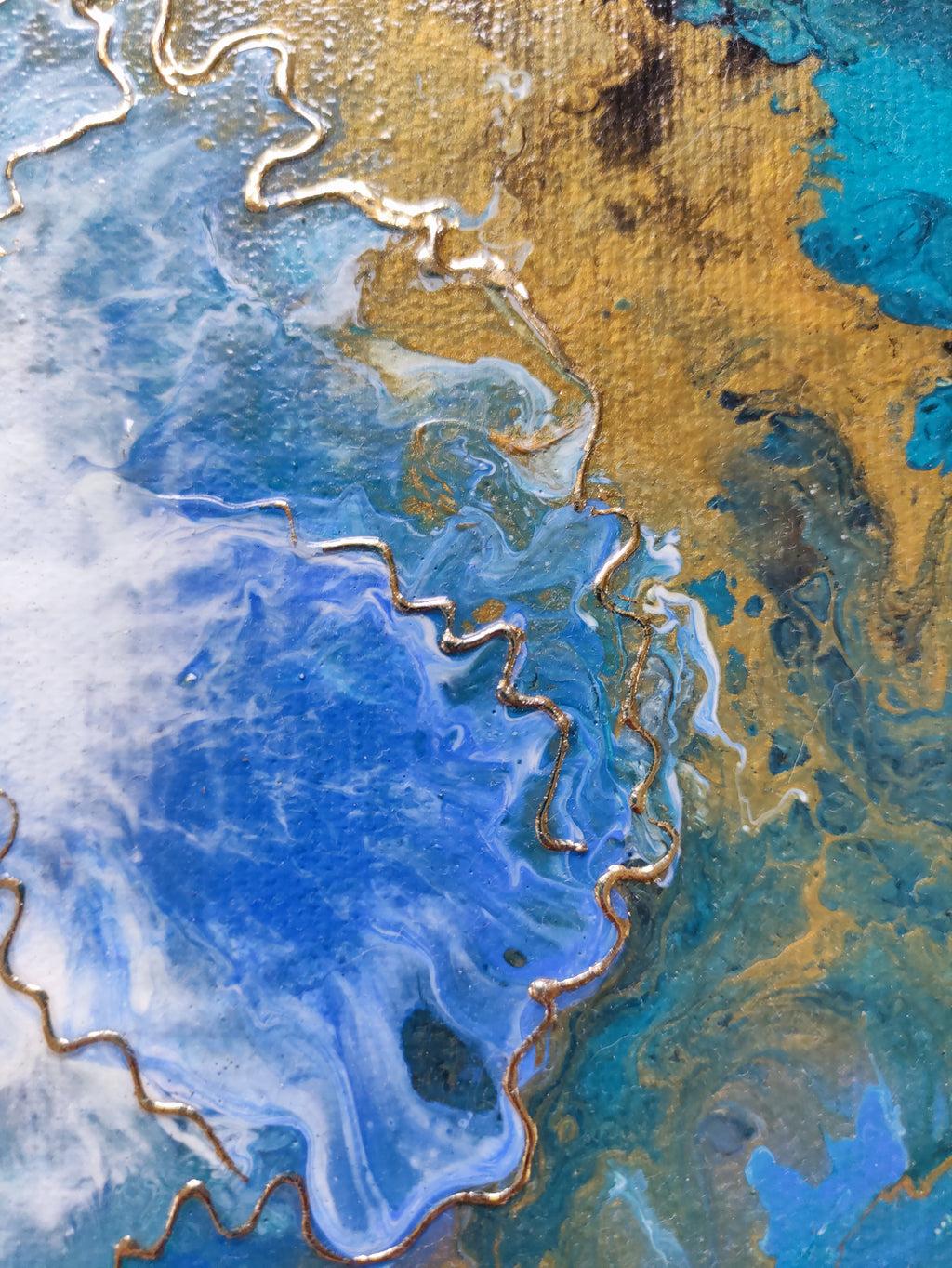 Abstract art with blue, gold, and brown colors