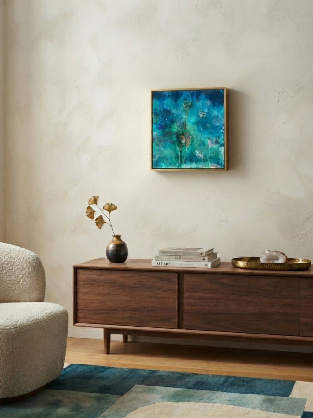 Living room with a wooden sideboard, abstract painting, and decorative items.