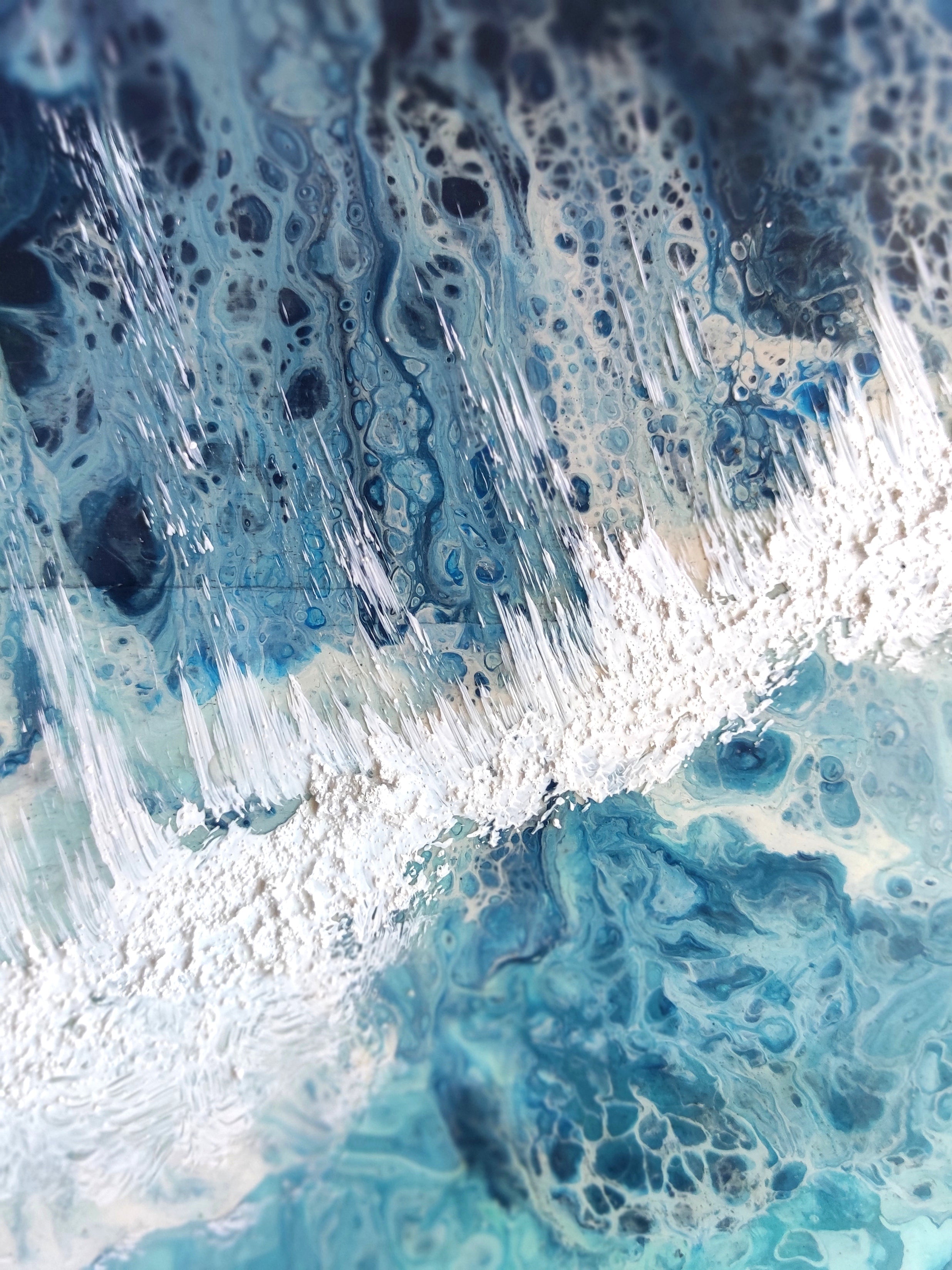 Close-up of blue and white foamy water texture
