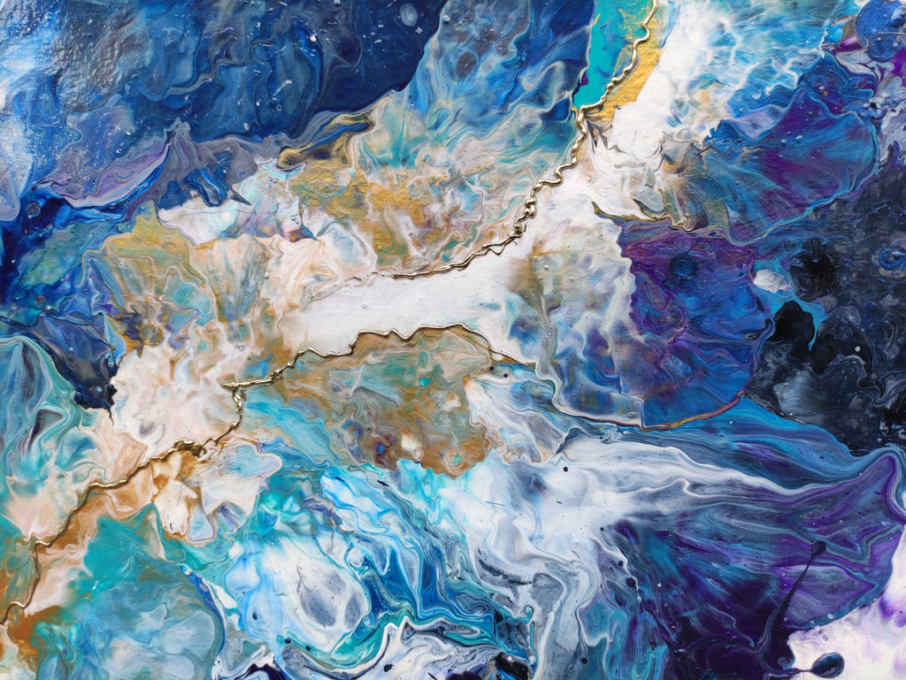 Abstract artwork with swirling colors of blue, white, and purple.