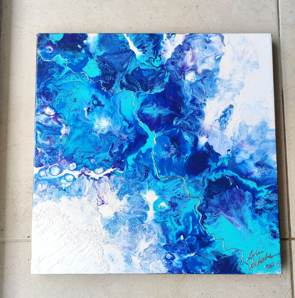 Abstract blue and white painting on a textured wall