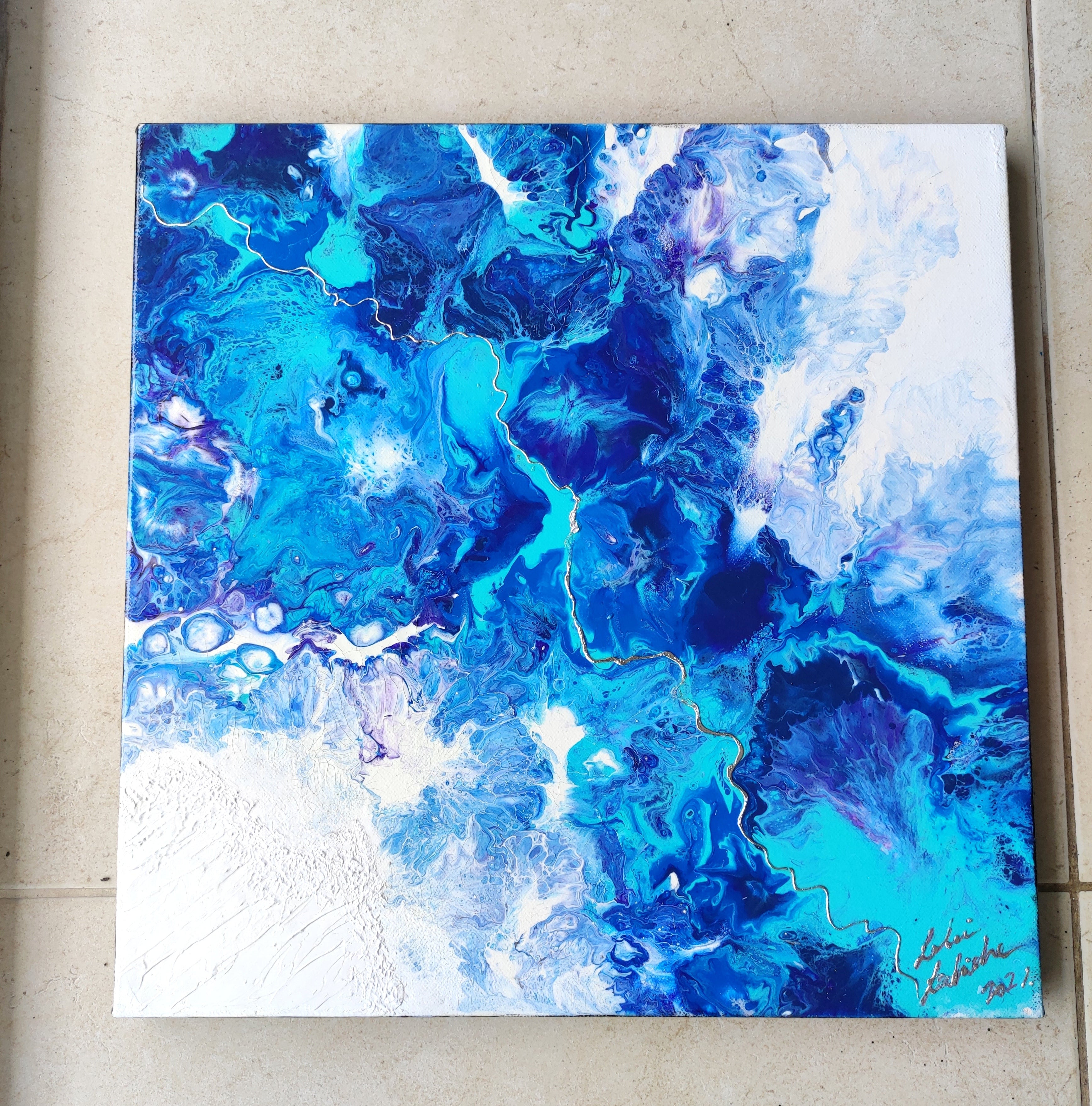 Abstract blue and white painting on a textured wall